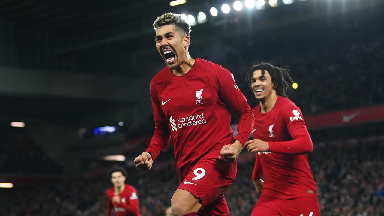 LIVERPOOL, ENGLAND – MARCH 05: Roberto Firmino of Liverpool celebrates after scoring the team's seventh goal with teammate Trent Alexander-Arnold during the Premier League match between Liverpool FC and Manchester United at Anfield on March 05, 2023 in Liverpool, England. (Photo by Michael Regan/Getty Images)