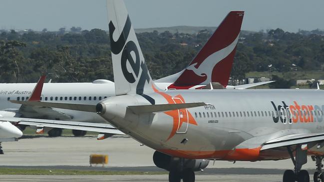 Tullamarine Airport arrivals and departures grinding down with the rest of Australian air travel. Jetstar, Rex and Qantas planes.     Picture: David Caird