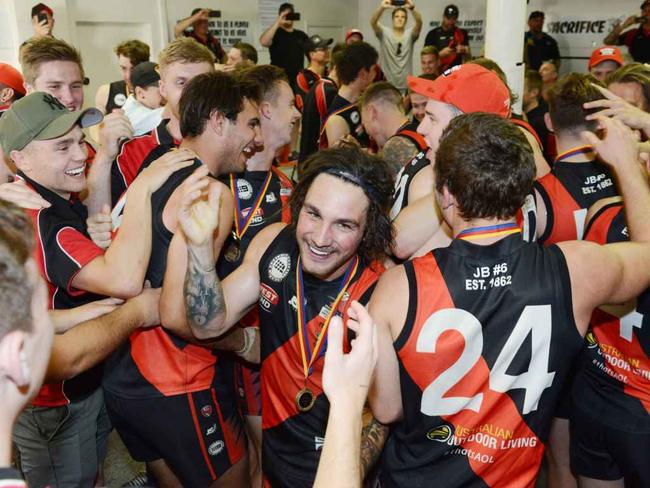 Adelaide Footy League, Division 1 Grand Final Tea Tree Gully v Rostrevor at Thebarton Oval, Saturday, September 22, 2018. Captain Alex McKay celebrates with Tea Tree Gully players after their win. Picture: AAP Image/ Brenton Edwards