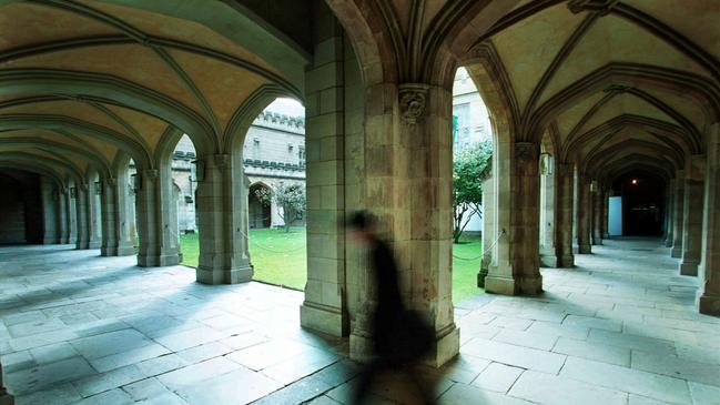 A student walks Melbourne University's old Law Quadrangle.