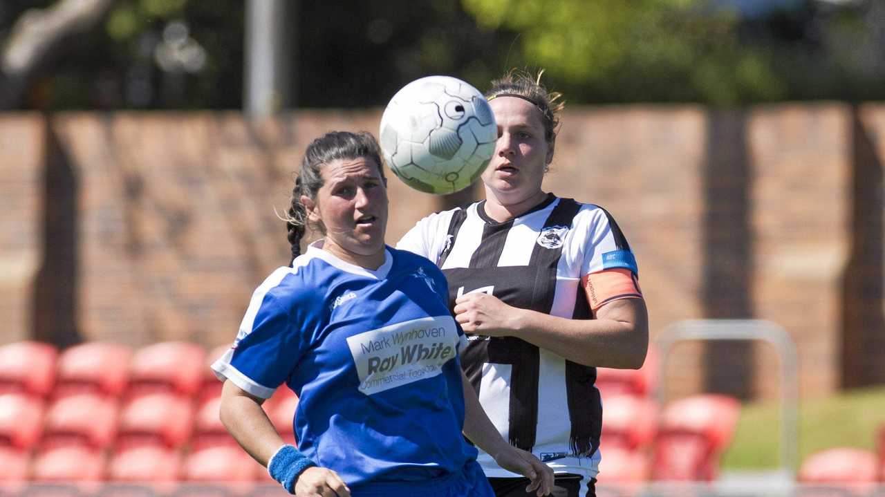 CLOSE CONTEST: Rockville's Penny Dukes (left) for Rockville and Willowburn's Kiama Gray battle for possession during last year's Toowoomba Football League Premier Women's grand final. Picture: Kevin Farmer