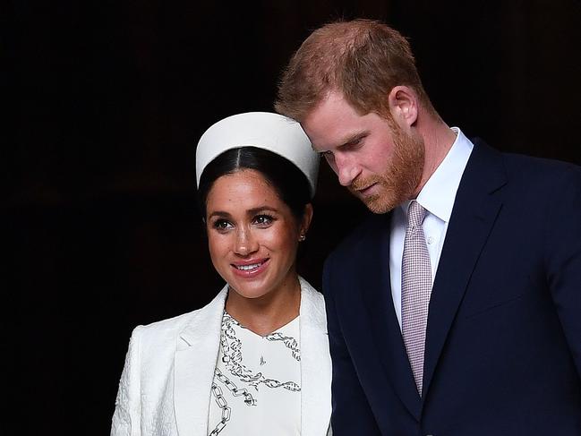 (FILES) In this file photo taken on March 11, 2019 Britain's Prince Harry, Duke of Sussex (R) and Meghan, Duchess of Sussex leave after attending a Commonwealth Day Service at Westminster Abbey in central London, on March 11, 2019. - Queen Elizabeth II will host a showdown meeting with Prince Harry on January 13, 2020 in an attempt to solve the crisis triggered by his bombshell announcement that he and wife Meghan were stepping back from the royal frontline. (Photo by Ben STANSALL / AFP)