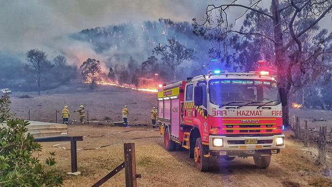 Firefighters from Fire and Rescue NSW attend to a bushfire in Tenterfield on the weekend. Picture: AAP Image/Supplied by Fire and Rescue NSW