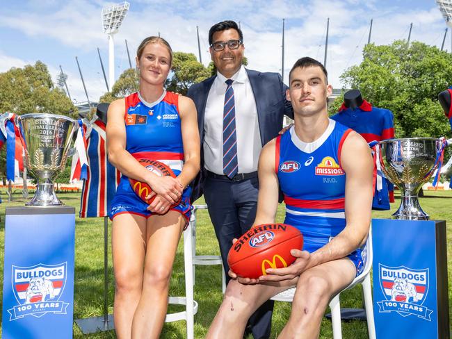 Sam Darcy (R), Ameet Bains (C) and Issy Grant (L) launch the Western Bulldogs 100 year anniversary. Picture: Brendan Beckett