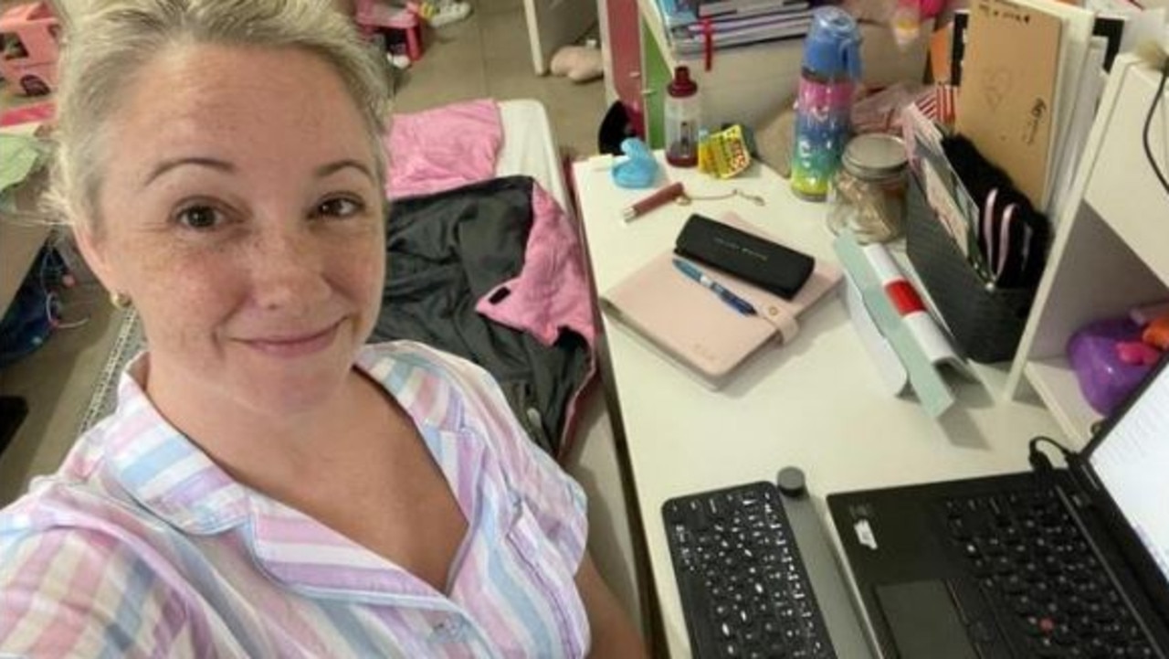 Claire, working in her PJs in Olivia’s bedroom next to her mattress on the floor.