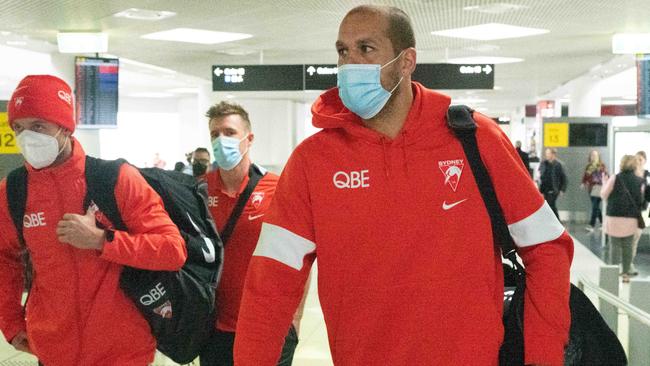 Lance Franklin arrives with the Sydney Swans team at Melbourne Airport. Picture: Tony Gough