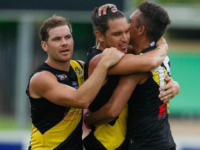 Cameron Ilett (Centre) celebrates a goal as Nightcliff V Tiwi at TIO Stadium .Pic Glenn Campbell