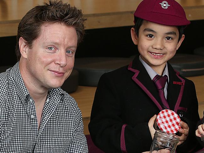 EMBARGO: DO NOT PUBLISH BEFORE SUNDAY SEPTEMBER 23 Scott Pape , The Barefoot Investor is pictured at Haileybury School in Melbourne promoting Barefoot Investor For Families.Prep students Ruby and Abdul are pictured with money jars. Picture : Ian CurrieScott Pape , The Barefoot Investor is pictured at Haileybury School in Melbourne promoting Barefoot Investor For Families.Prep students Ruby and Abdul are pictured with money jars. Picture : Ian Currie