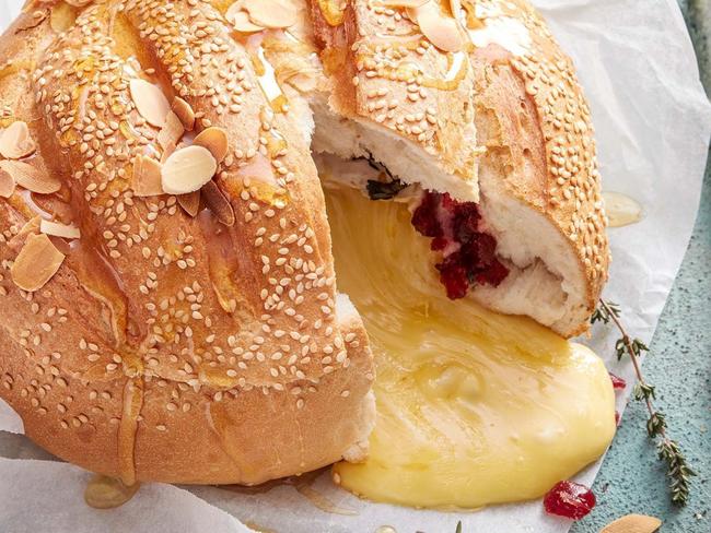 Baked brie and cranberry in a cob.