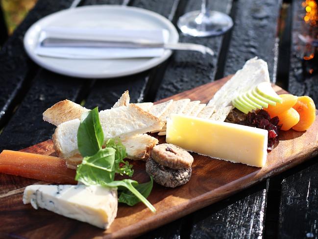 The cheese platter features Coal River Farm triple cream brie, Coal River Farm blue and Pyengana clothbound cheddar served with dried fruits, nuts and quince paste. Picture: LUKE BOWDEN