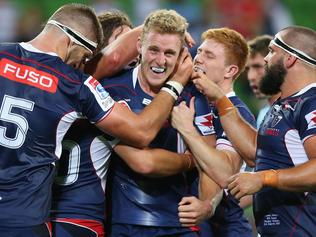 MELBOURNE, AUSTRALIA - MARCH 24:  Reece Hodge of the Rebels (C) celebrates a try with teammates during the round five Super Rugby match between the Rebels and the Waratahs at AAMI Park on March 24, 2017 in Melbourne, Australia.  (Photo by Michael Dodge/Getty Images)