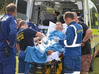 A man receives treatment after being speared by a marlin off Wooli before he was flown to Coffs Harbour hospital.