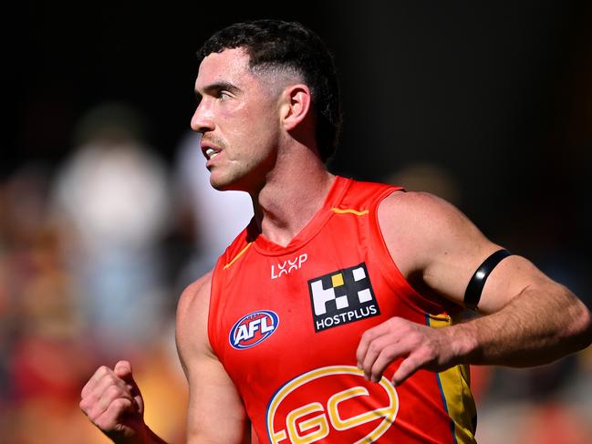 GOLD COAST, AUSTRALIA - AUGUST 17: Sam Flanders of the Suns celebrates kicking a goal during the round 23 AFL match between Gold Coast Suns and Melbourne Demons at People First Stadium, on August 17, 2024, in Gold Coast, Australia. (Photo by Albert Perez/AFL Photos via Getty Images)