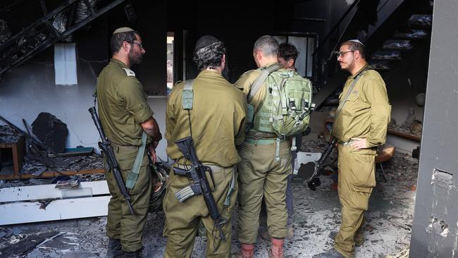 Members of the Israeli army pray in memory of a fellow soldier killed on October 8 during an attack by Palestinian militants in kibbutz Beeri near the border with Gaza on October 17, 2023. Picture: Jack Guez/AFP