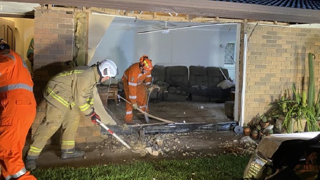 SES and CFS volunteers clean up after a van ploughed into the front window of a house at Nairne overnight. Picture: SA Police