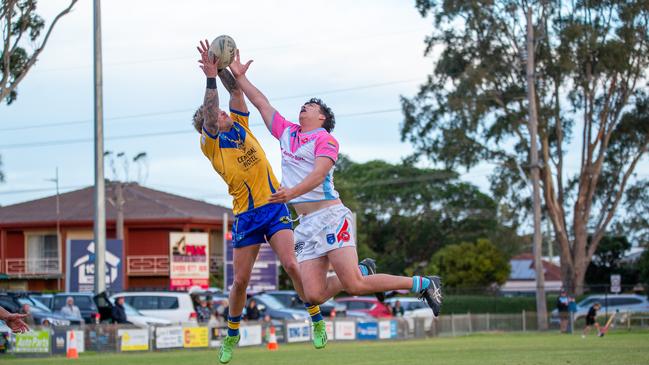 Kye Deane and Jarrah Treweek compete for a high ball on the goal line. Picture: Thomas Lisson