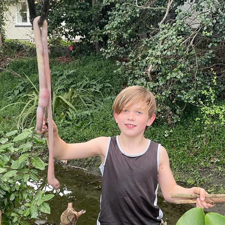 Barnaby Domigan discovered the massive worm in his backyard in New Zealand. Picture: Facebook/Jo Domigan