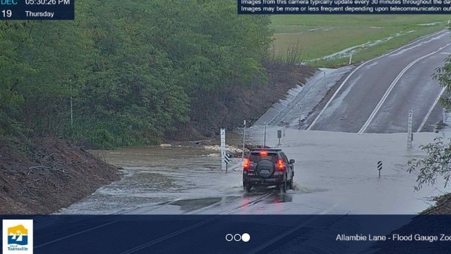 Allambie Lane has been flooded over and motorists have been warned not to cross.