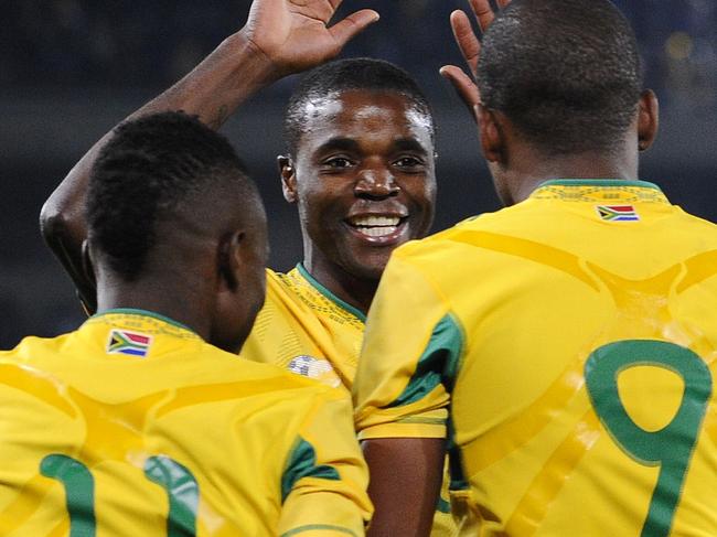 South African striker Katlego Mphela(R), Captain Aaron Mokoena(C) and midfielder Teko Modise(L) celebrate after scoring a goal against Guatemala on May 31, 2010 during a friendly match at the Peter Mokaba stadium in Polokwane, South Africa. AFP PHOTO/GIANLUIGI GUERCIA