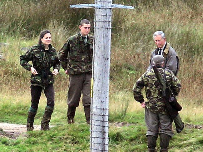 Prince Charles watches as Prince William and Kate Middleton gets instruction in gunning for her target, a stag, at Balmoral Estate.