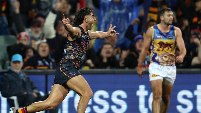 Josh Rachele celebrates after kicking a goal from the boundary line. Picture: Sarah Reed/AFL Photos via Getty Images