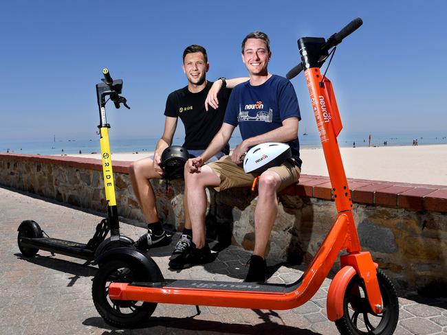 SCOOTERS BEEN APPROVED AT THE BEACH. Toby Pym (Operations Manager RIDE) and  Jayden Bryant (Nueron City Manager) at Glenelg Beach. Picture: Tricia Watkinson