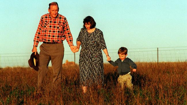 Fischer with wife Judy and son Harrison on their Boree Creek property in 1996.