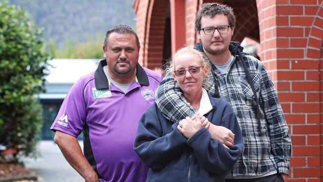 Elaine Lovell, centre, with husband Noel, left, and son Dean at the Huonville community centre. The Lovells all worked for Ta Ann at the Southwood Mill that was damaged in the January bushfires. Picture: LUKE BOWDEN