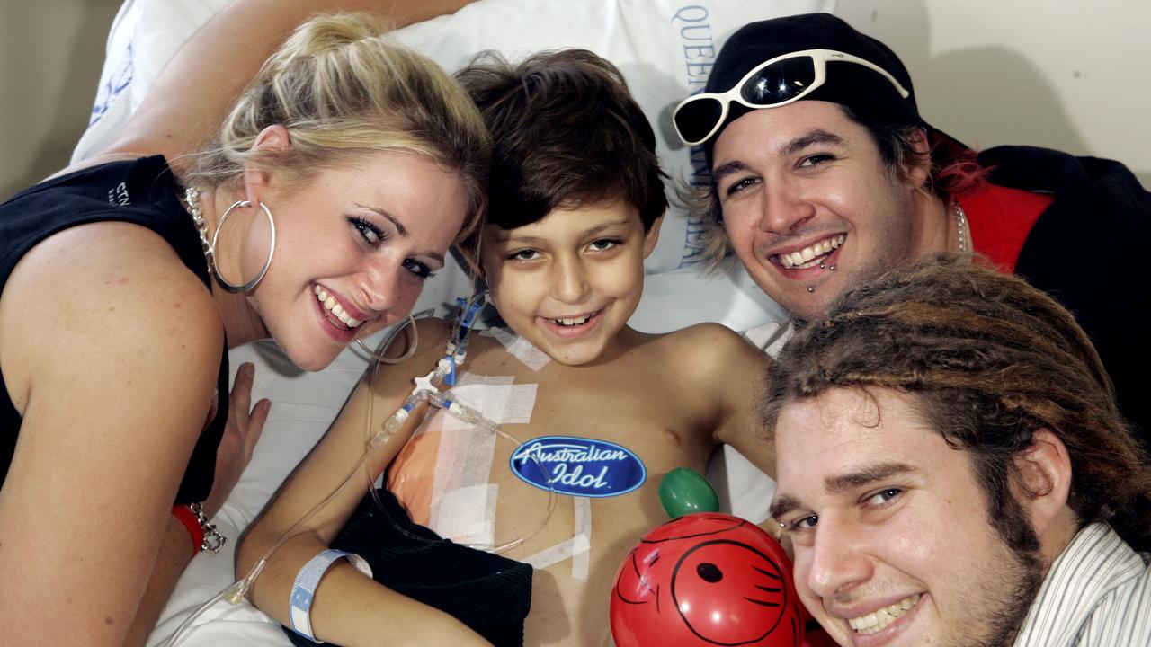 Australian Idol contestants Kate DeAraugo and Lee Harding with Dan England visiting liver-transplant recipient Joe Klocek at Royal Children's Hospital. Picture: James Robertson