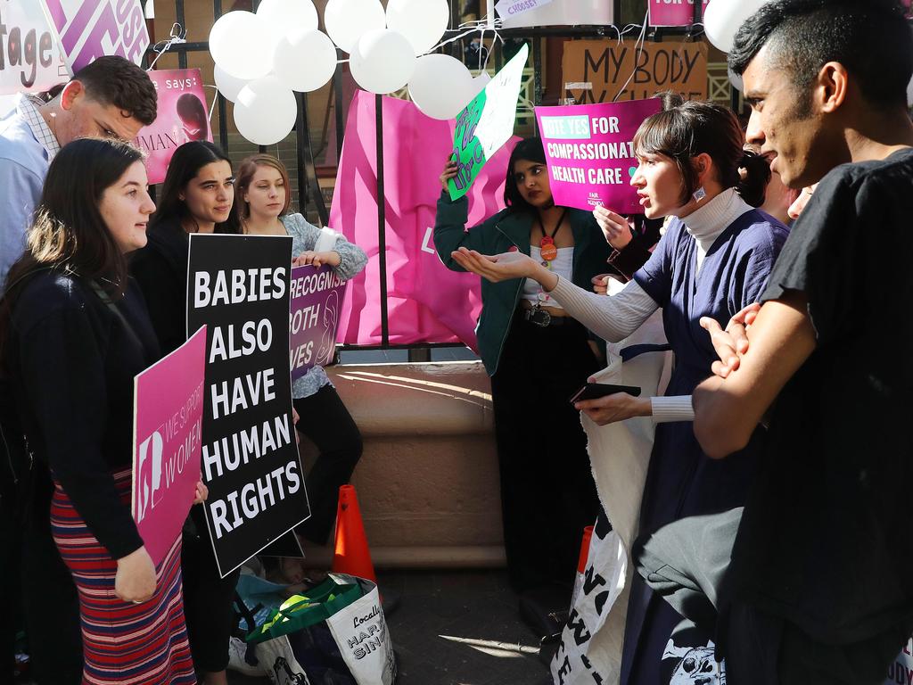 Pro life and pro choice protestors gathered at the front of NSW State Parliament in Sydney ahead of the debate of a possible abortion bill. Picture: Richard Dobson