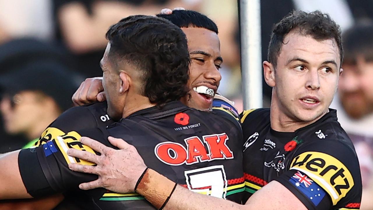 PENRITH, AUSTRALIA - APRIL 24:  Stephen Crichton of the Panthers celebrates with team mates after scoring a try during the round seven NRL match between the Penrith Panthers and the Canberra Raiders at BlueBet Stadium on April 24, 2022, in Penrith, Australia. (Photo by Matt Blyth/Getty Images)