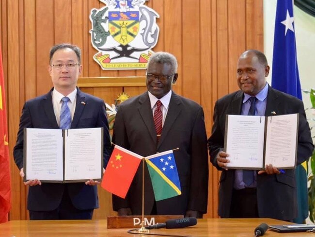 China’s first ambassador to the Solomon Islands Li Ming, left, and the Prime Minister Manasseh Sogavare, middle. Source: Supplied