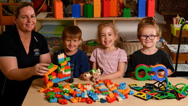 Tina Mackenzie with Cruz Newman, 4, Zahra Murkin, 5, and Rixon Arena, 4, at the Educating Kids Early Learning Centre in Townsville. Photo: Evan Morgan.