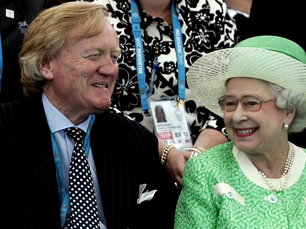 Queen Elizabeth, right, with Ron Walker, then-chairman of the Commonwealth Games in Melbourne in 2006. Picture: REUTERS/Rick Rycroft/Pool