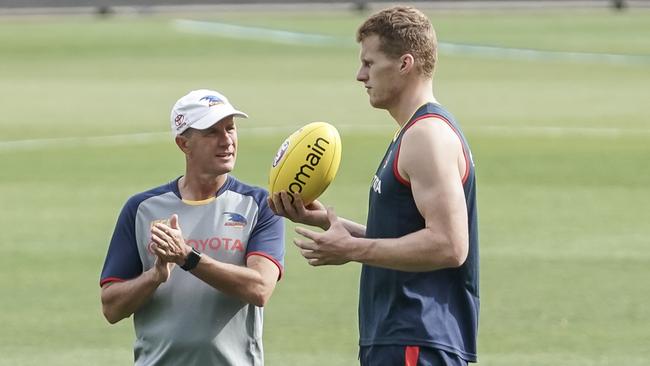 Reilly O'Brien discusses his rising SuperCoach price with Adelaide Crows coach Don Pyke. Picture: AAP/MIKE BURTON