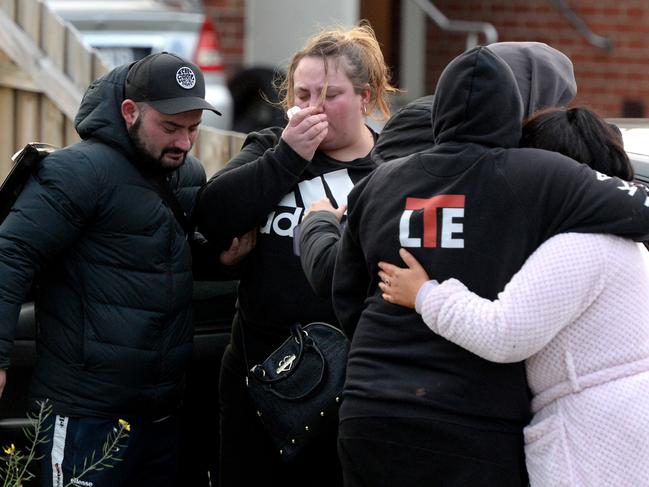 Relatives and friends outside the Broadmeadows home. Picture: Andrew Henshaw