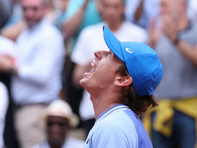 Australia's Alex De Minaur celebrates after winning against Russia's Daniil Medvedev at the end of their men's round of sixteen singles match on Court Suzanne-Lenglen on day nine of the French Open tennis tournament at the Roland Garros Complex in Paris on June 3, 2024. (Photo by ALAIN JOCARD / AFP)