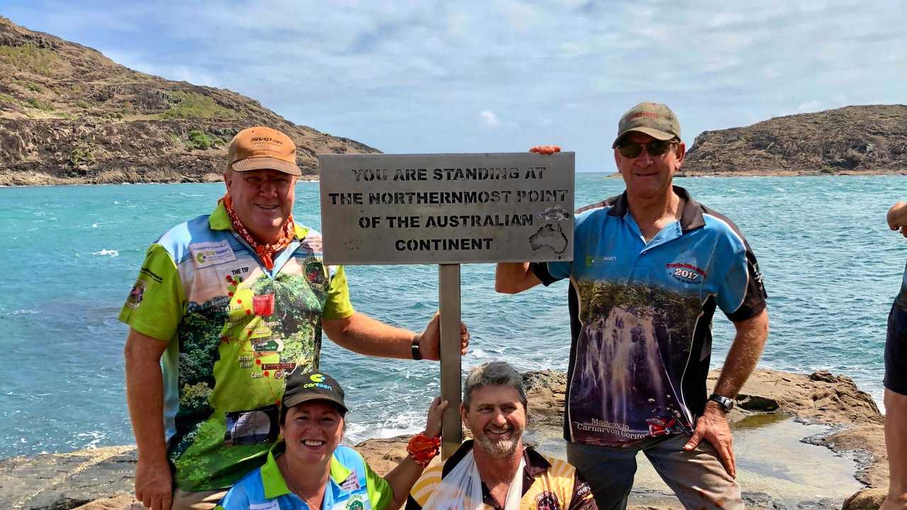 END OF THE ROAD: Airlie Beach residents (back, from left) Tony Schulz, Rowan Spruce, (front, from left) Leonie Brown and Matt Pitt at the tip of Cape York during the Cairns to the Cape Postie Safari. Picture: Contributed