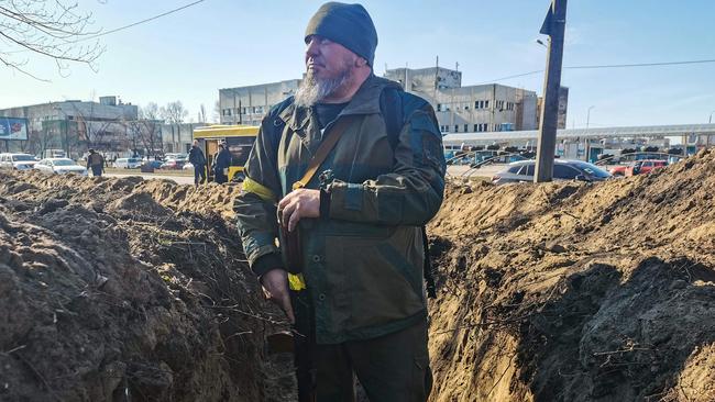 A volunteer prepares a rear post with trenches in Kyiv. Picture: AFP