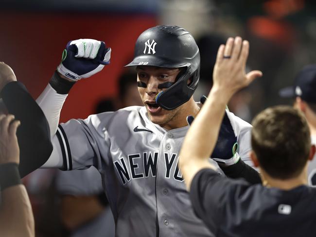 ANAHEIM, CALIFORNIA - AUGUST 29: Aaron Judge #99 of the New York Yankees celebrates his 50th home run of the season against the Los Angeles Angels in the eighth inning at Angel Stadium of Anaheim on August 29, 2022 in Anaheim, California.   Michael Owens/Getty Images/AFP == FOR NEWSPAPERS, INTERNET, TELCOS & TELEVISION USE ONLY ==