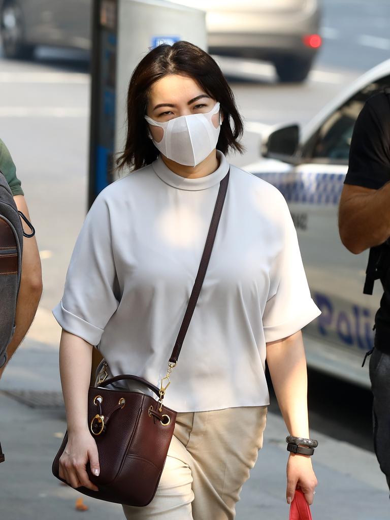 As smoke from bushfires engulfs Sydney, morning commuters are pictured wearing face masks as they make their way to work. Picture: MATRIX