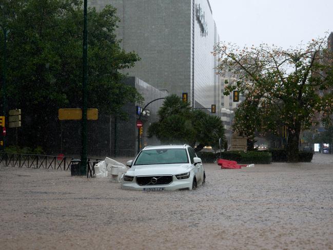 A car is partly submerged in flood waters in Malaga. Picture: Getty Images