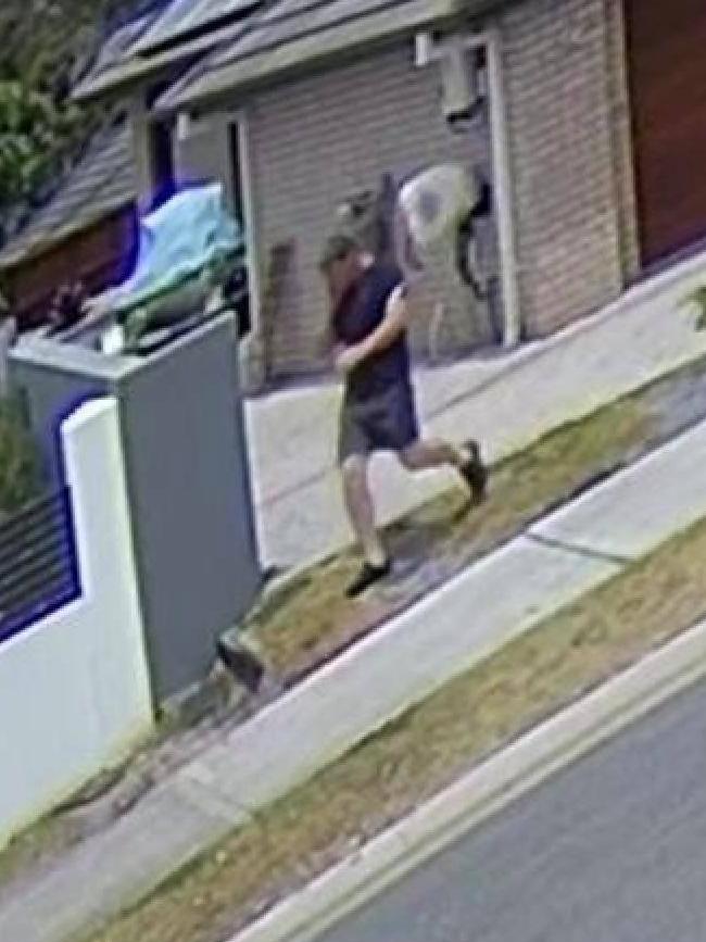 Footage of a stranger entering a yard on the Gold Coast, caught on the security camera of a Pacific Pines resident who had been robbed.