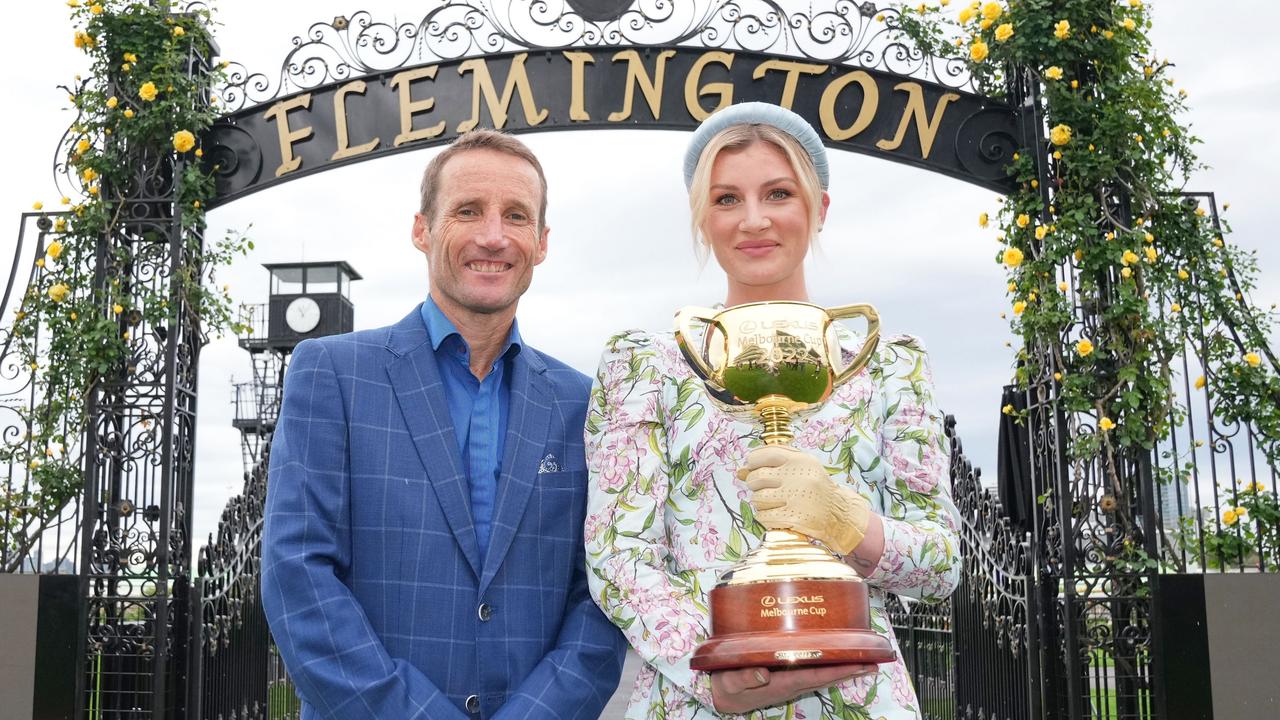 Jamie Kah, with Damien Oliver, holding the Melbourne Cup in 2022. Picture: Scott Barbour/Racing Photos via Getty Images