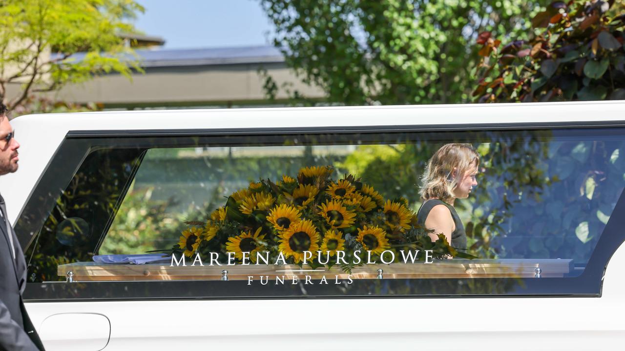 There were sunflowers placed on the coffin.