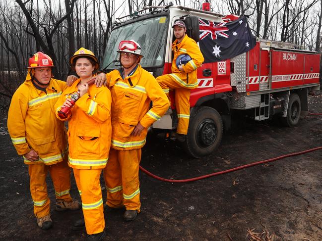 HOLD FOR AUSTRALIA DAY -----CONTACT HERALD SUN PIC DESK BEFORE USING---East Gippsland fire affected areas.  Buchan CFA captain Peter While, Jess White, Bob Carney and Daniel White on their truck in Buchan South. Picture: Alex Coppel.