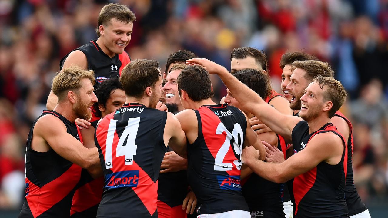 Essendon players couldn’t wait to get around McDonald-Tipungwuti after his goal. Picture: Getty Images