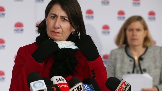 Premier Gladys Berejiklian removes her mask to speak during a COVID-19 update and press conference on Monday. Photo by Lisa Maree Williams/Getty Images