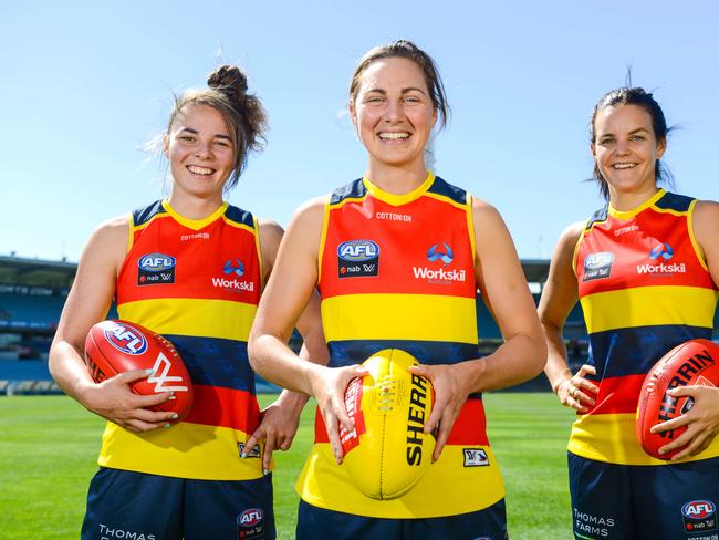 Crows Women AFL players Jenna McCormick (L), Rheanne Lugg (C) and Sally Riley (R) Thursday, January 25, 2018. (AAP Image/ Brenton Edwards)