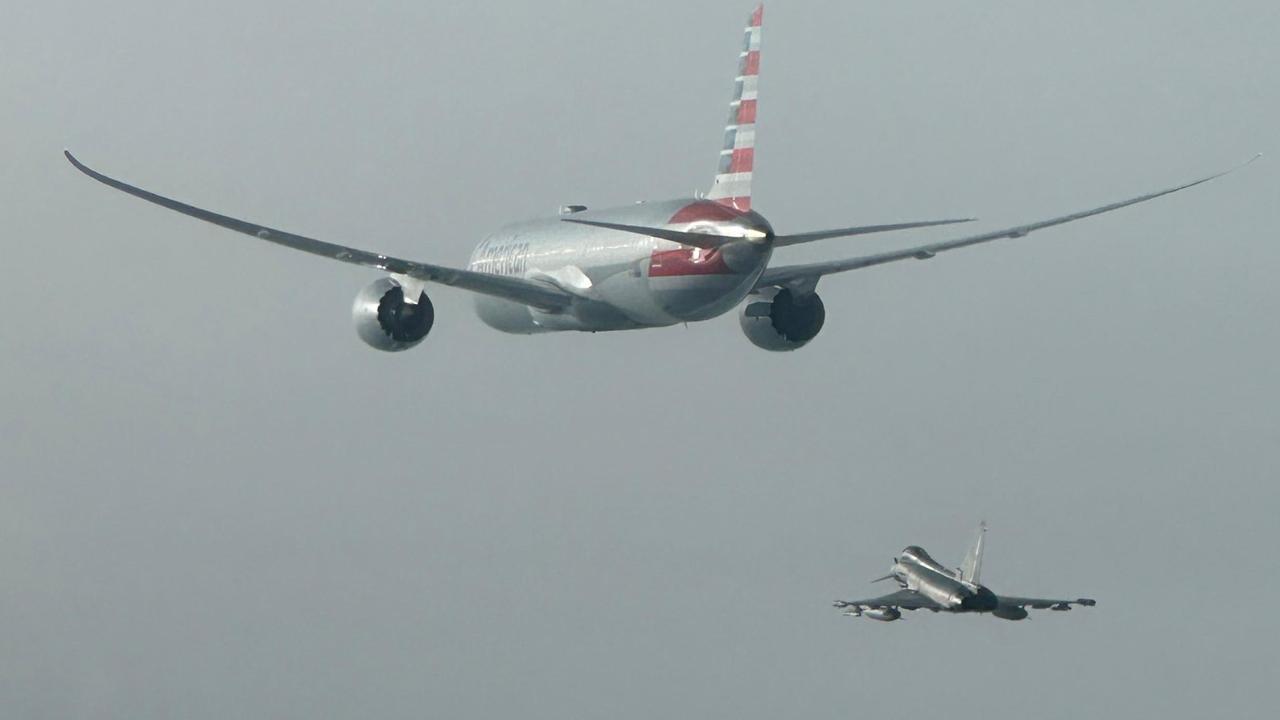 Terrifying moment fighter jets escort plane after bomb threat